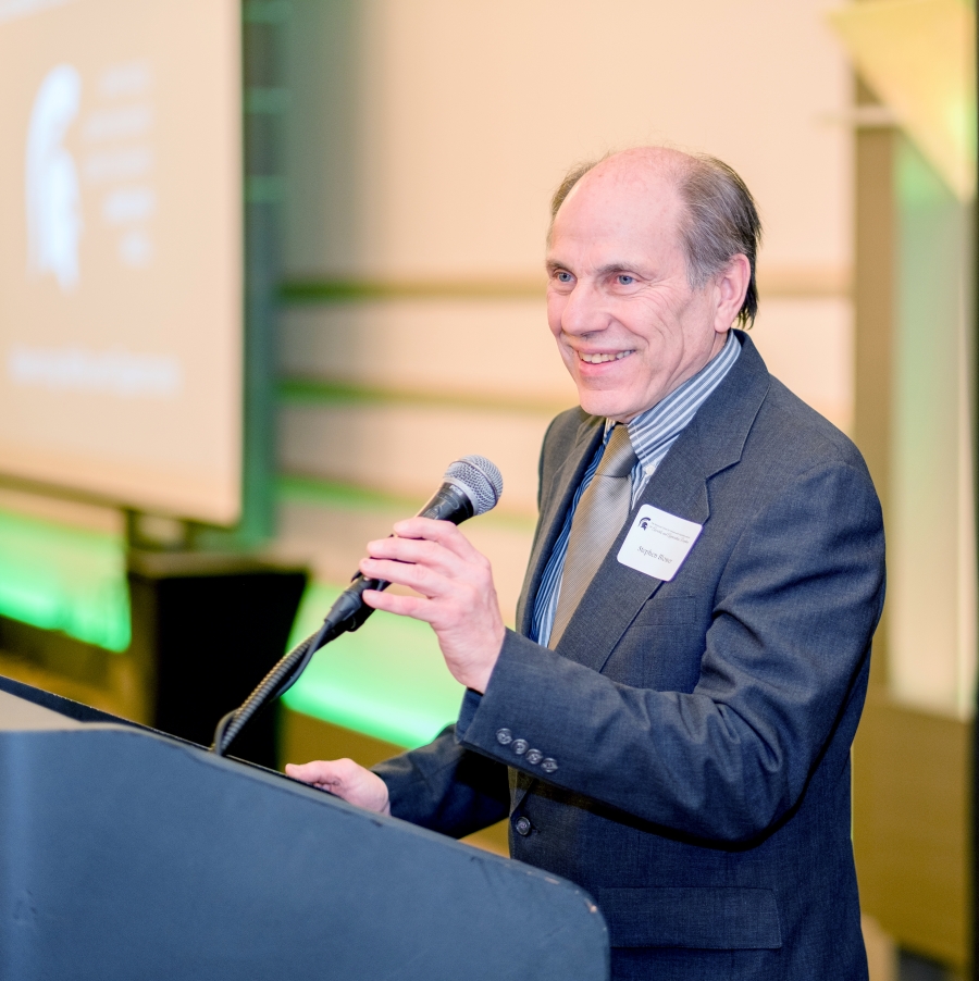 Photo of Stephen Blosser speaking at a podium