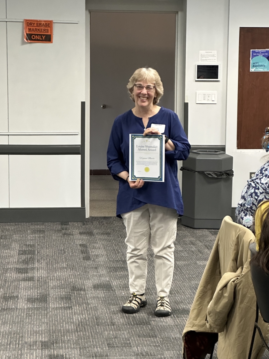 Ginger Martz holding award