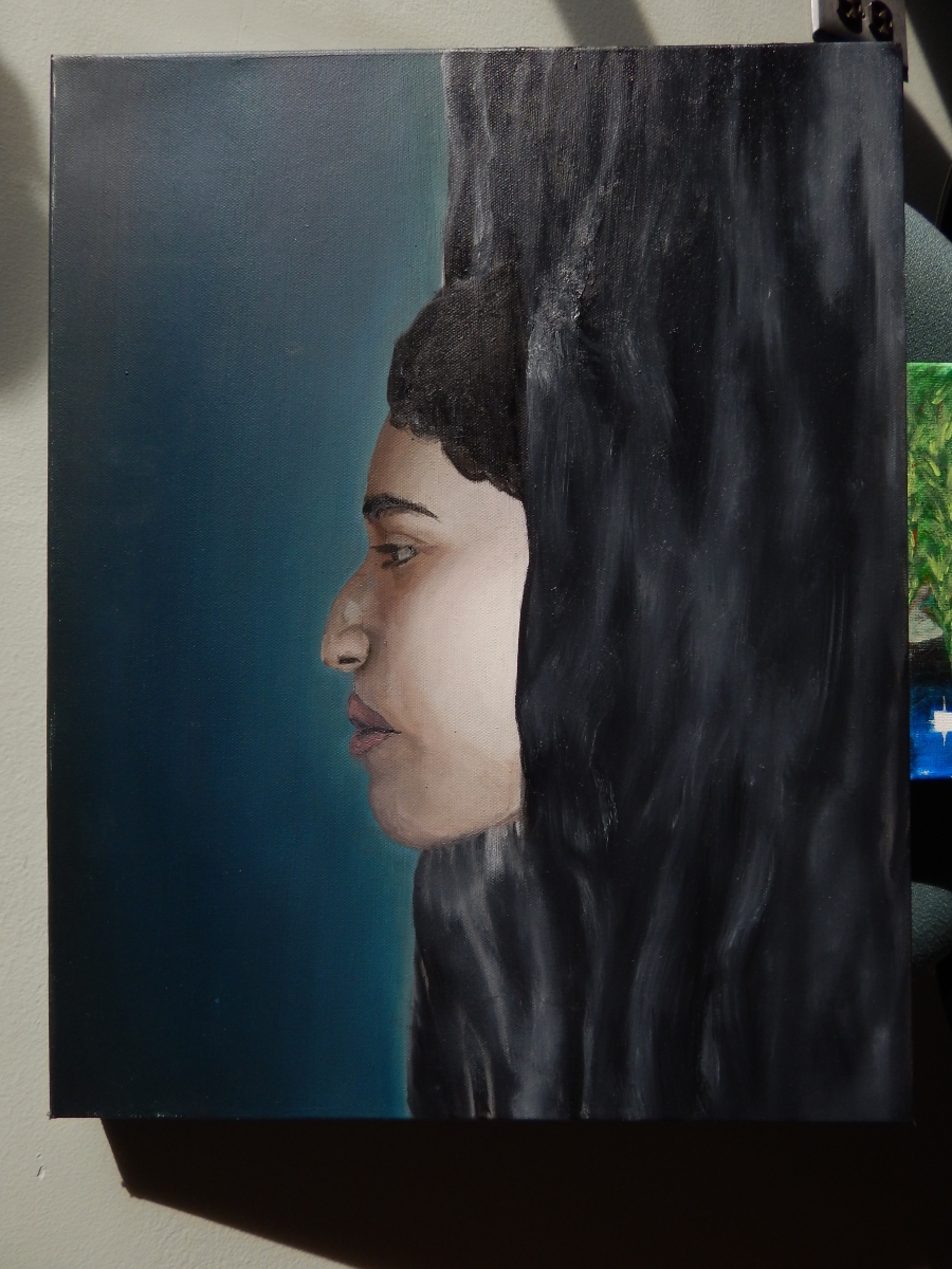 Artist has shared piece titled Autophobia which is a canvas with oil paint depicting a  face coming out of water. The image features a deep, inky waters depicted below a dark moody blue sky. In the center, a human face in profile is seen emerging from the water with nose pointed to the sky. The individual has dark hair which is mostly submerged in the water. The face pulls in the viewer’s gaze as a highlighted area contrasting with the dark colors. The eye visible is half open and suggests 