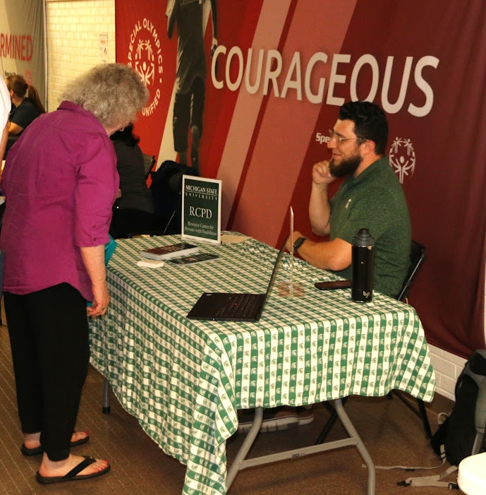 Tyler interacting with a guest at the event